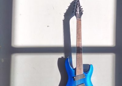 blue and brown stratocaster guitar